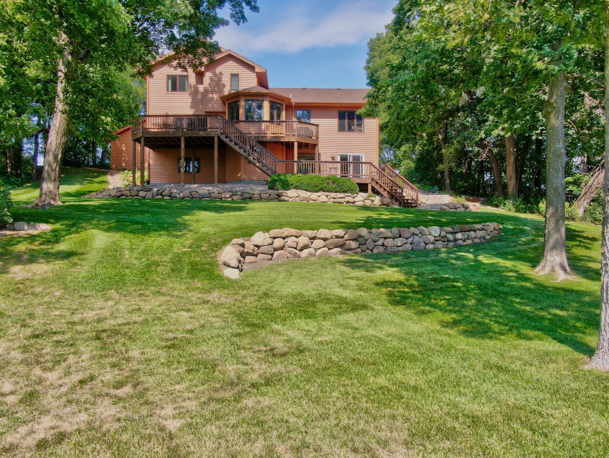 The extensive boulder landscaping accents this property perfectly! With an easy to mow lawn you hardly need to even get off your riding mower!