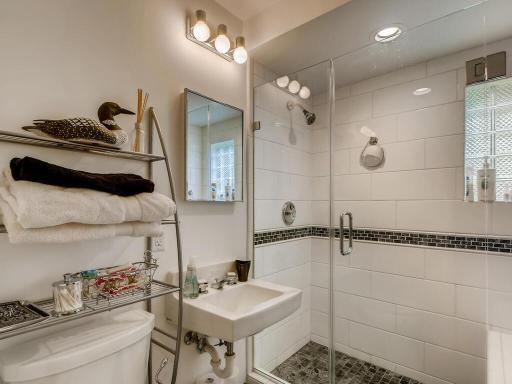 Lower level has a beautifully remodeled 3/4 bath with tiled shower.