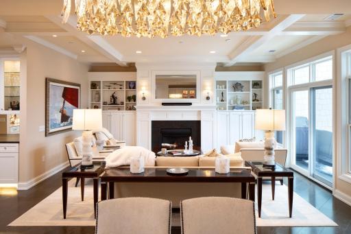 Cozy gas fireplace and custom built-ins anchor one end of the gathering area