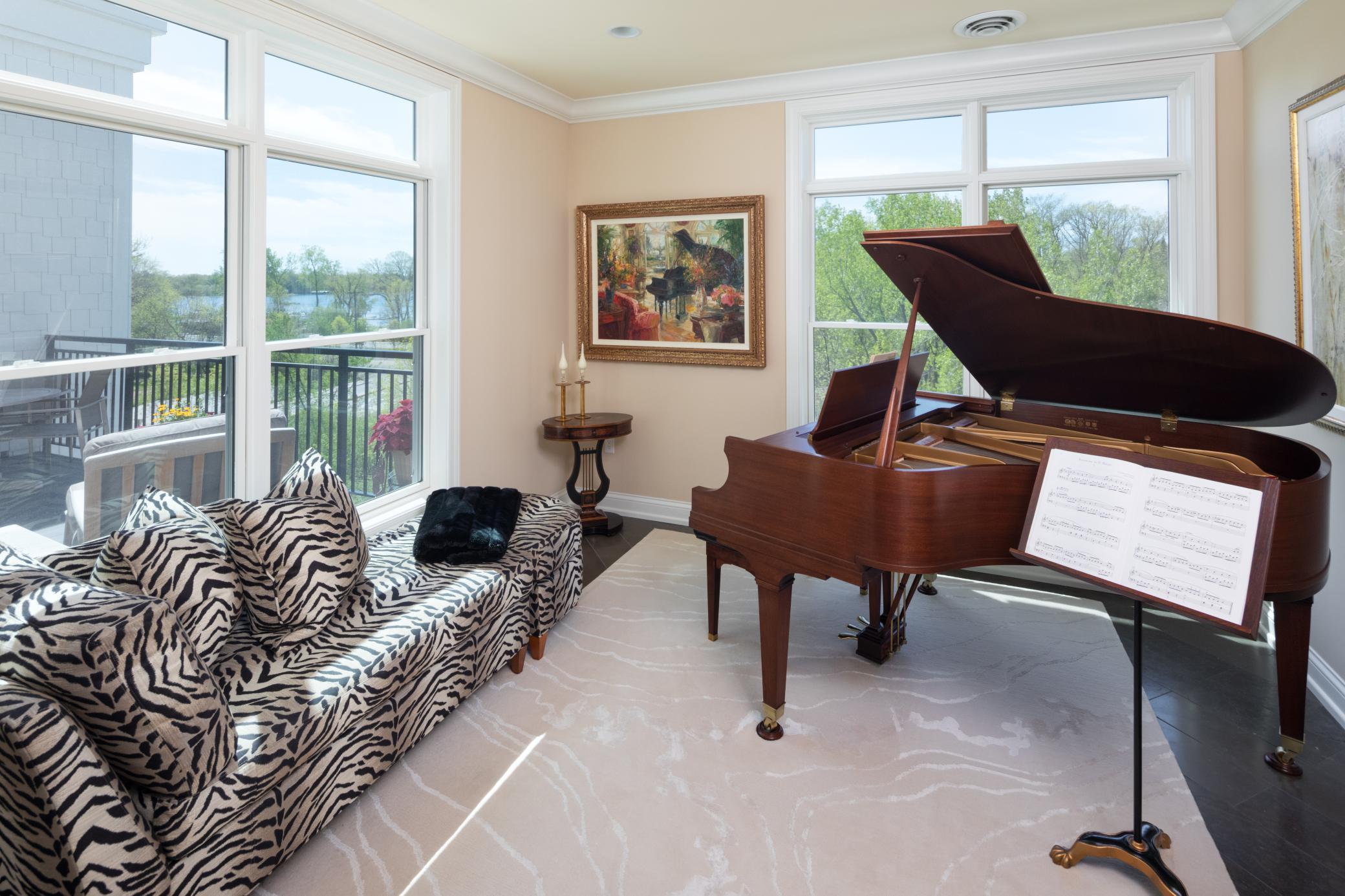 Spacious sitting room with corner windows and views of Lake Minnetonka