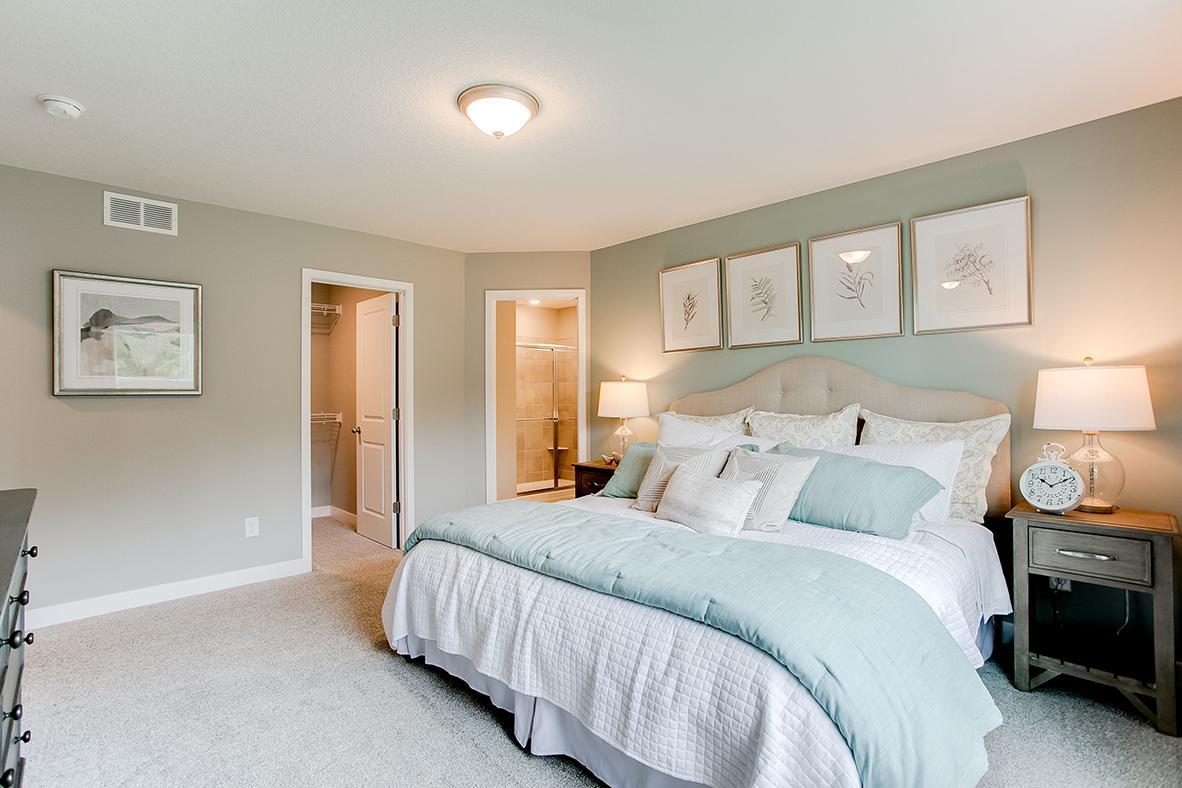 A second view of the Primary Suite. Shown here with a King-sized bed, the room is overly spacious and offers the perfect setting to start and finish each day in!