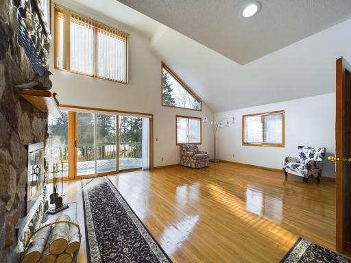 Watch the wood-burning fireplace from many angles in this house, including the family room here or informal dining room on the other side.