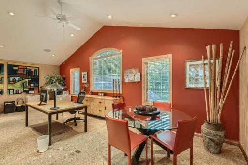This loft area is currently being used as a complete office space with conference table but the usage is limitless. Playroom for the kids, workout area, creative area. It is light and bright and the possibilities are endless