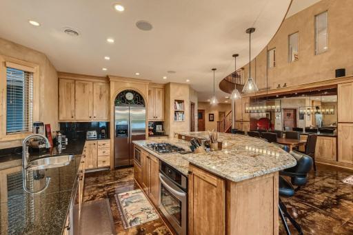 Kitchen has blt in microwave and oven in center island plus it opens to the family room and dining area as well.