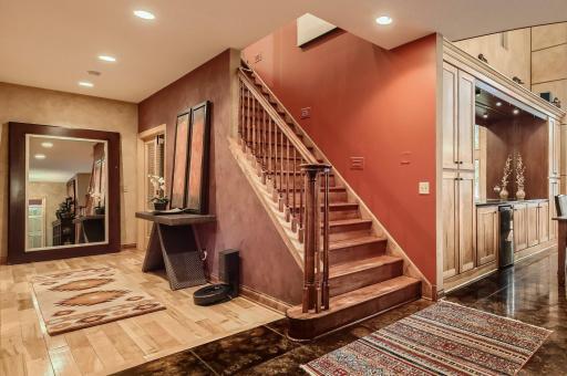 From the front foyer you can go down the hall to the owners suite, first floor office or 2nd main flr bedroom if you need and a 3/4 bath for your guests to use. Upstairs you have so much more to see