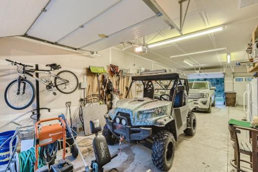 Check out the garage! It is a two car up front with an oversized 3rd stall tandem style in the back. This garage is heated and it has a drive thru door so you can drive from the driveway right thru to the lakeside of the property.