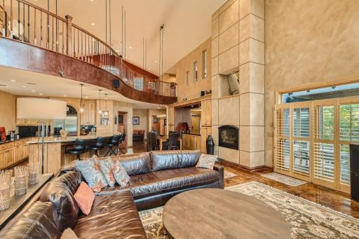 Floor to ceiling gas fireplace, 10 ft curved center island follows the curvature of the architectural suspended loft area. This home has been custom blt from the ground up and you can see it in every room of this home