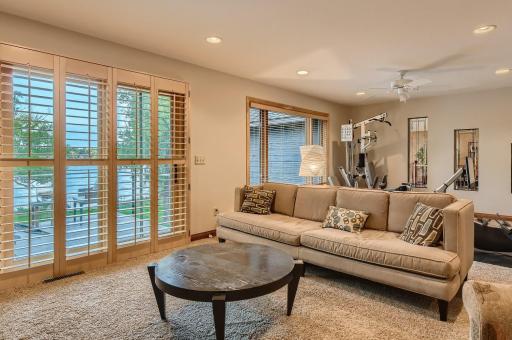 Welcome to the upstairs family room. It is 13x25 so large enough for a couch area and a ton of workout equipment. Another place for to hang out and relax and it comes with doors that lead out to a 12x12 main free deck overlooking the backyard