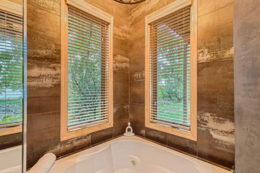 Feel like relaxing after a long day? This corner jacuzzi tub should do the trick