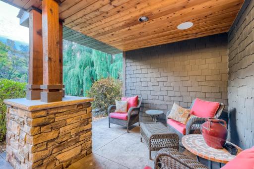 One the front of the home, by the front entry you will find this cozy front porch. This home is very private as it only has neighbors on one side so you can sit out front or in the back and get all the privacy you want or need.