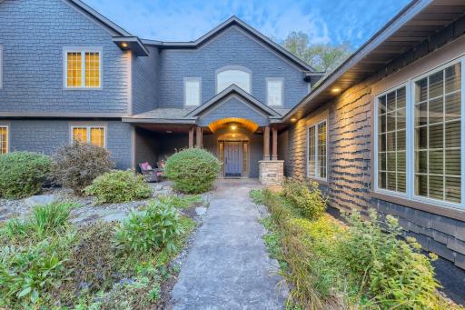 You will find this home has hardi board siding and shakes with 50 yr warranty. It has a concrete driveway with stamped sidewalks and patios on both sides of the home. The landscaping is gorgeous, yet low maintenance perennials