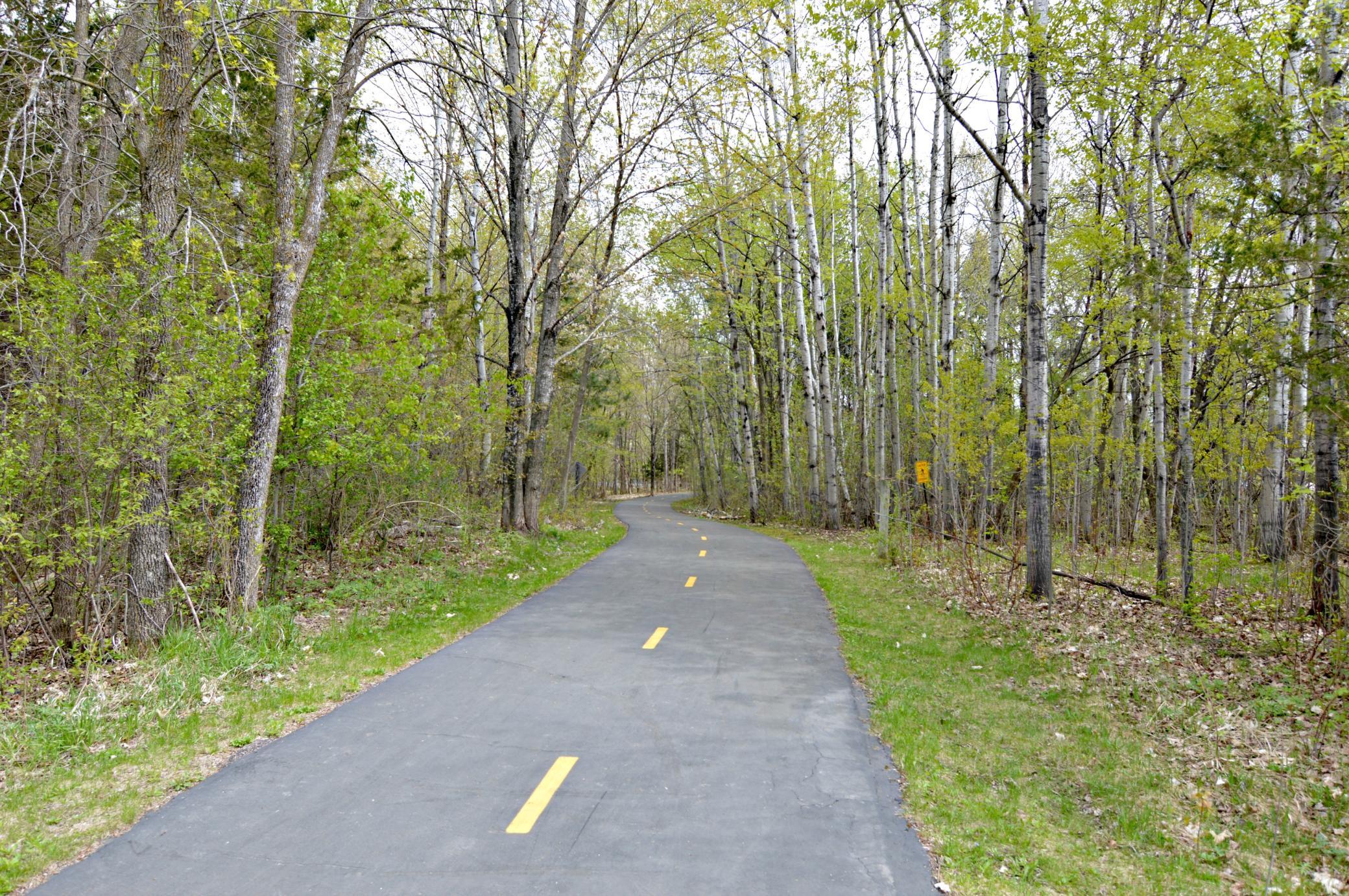 Home to 4,900 acres of recreational bliss and walking distance from your new home, Elm Creek Park is an outdoor haven and features activities for all seasons - including biking, running, swimming, playing, skiing, tubing, a nature center and more!!