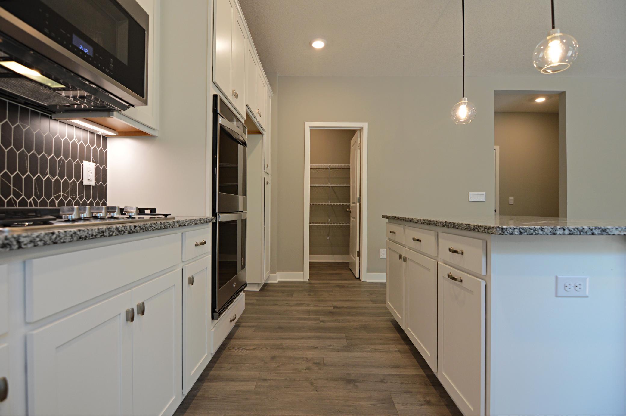 Built to perform, not even a single element was missed. Stunning stainless steel appliances, Granite coated countertops (including the massive island) and an extra-deep pantry! What time is dinner!?