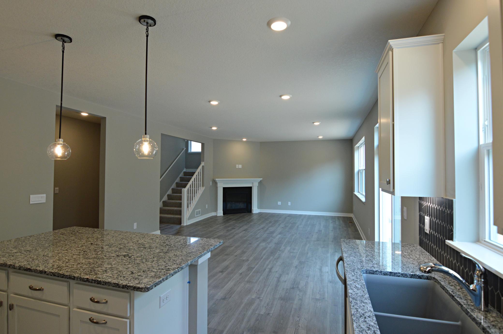 The open-concept floor plan epitomizes itself in a plan that flows seamlessly from kitchen to dining to the family room!