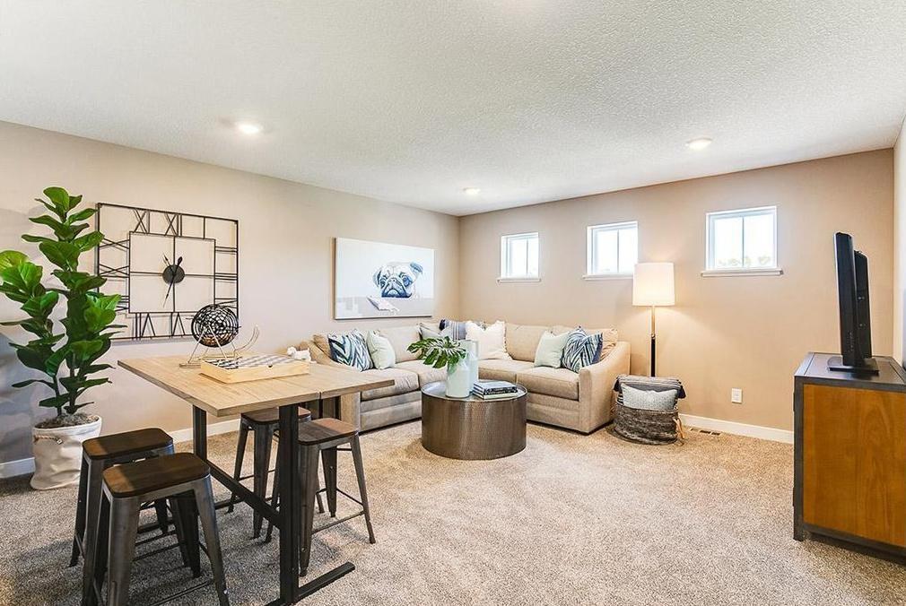 Once upstairs, the entire level flows from the focal point offered by this huge loft space. Sure to become a family favorite hangout spot, the room is just steps from each of the home's four upper level bedrooms! (Photo of model)