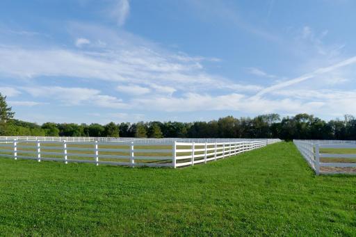 6 - 4 board vinyl fenced grass pastures; 1 level grass pasture can be used as outdoor ring; 3 grass pastures