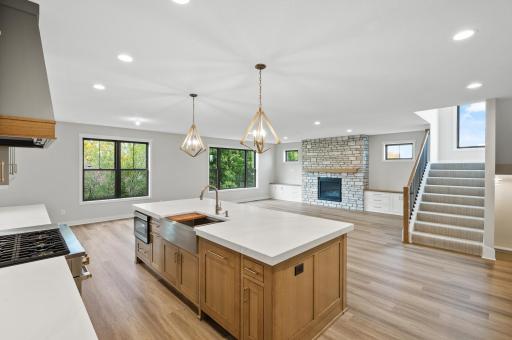 Kitchen island with views of the open concept living and dining rooms