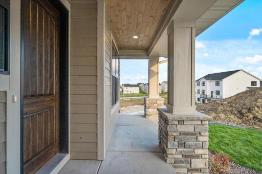 Front exterior covered porch with wood ceiling