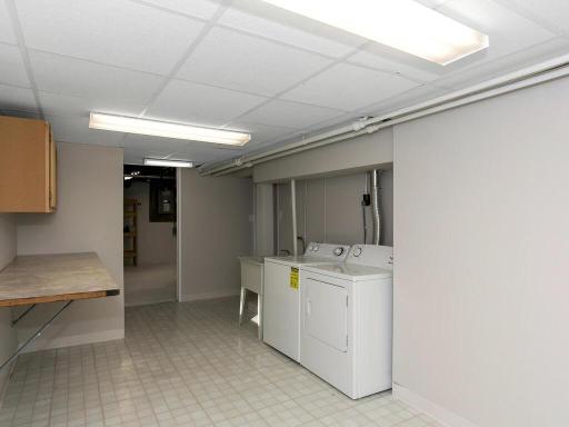 Lots of space in this laundry/craft room for storage or your own ideas.