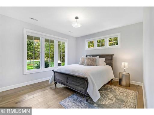 A cozy second bedroom makes wonderful use of the Marvin windows on two walls. So much natural light can be found thru-out this 4,084 finished square foot home.