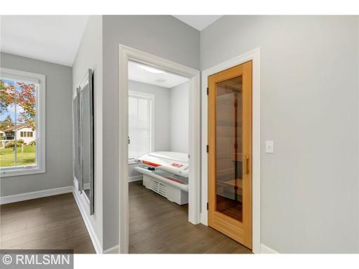 The "tanning bed room" is already retro-fitted with all the plumbing in the floors and walls to make a fourth bathroom. The larger room that holds the sauna & tanning bed room could easily be made into a second master bedroom with ensuite.