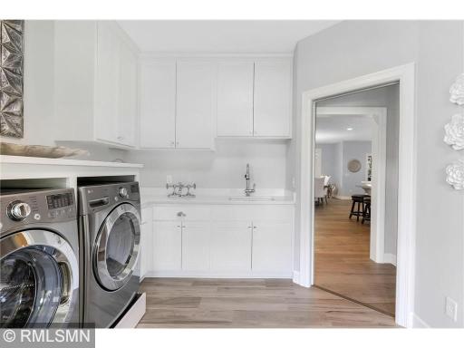 You didn't think they would forget the laundry room sink in here, did you? This room might actually make you enjoy doing your laundry:-) So spacious, open and bright.