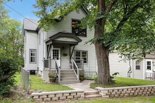 Nestled in the trees in South Saint Paul! Notice the new front porch?