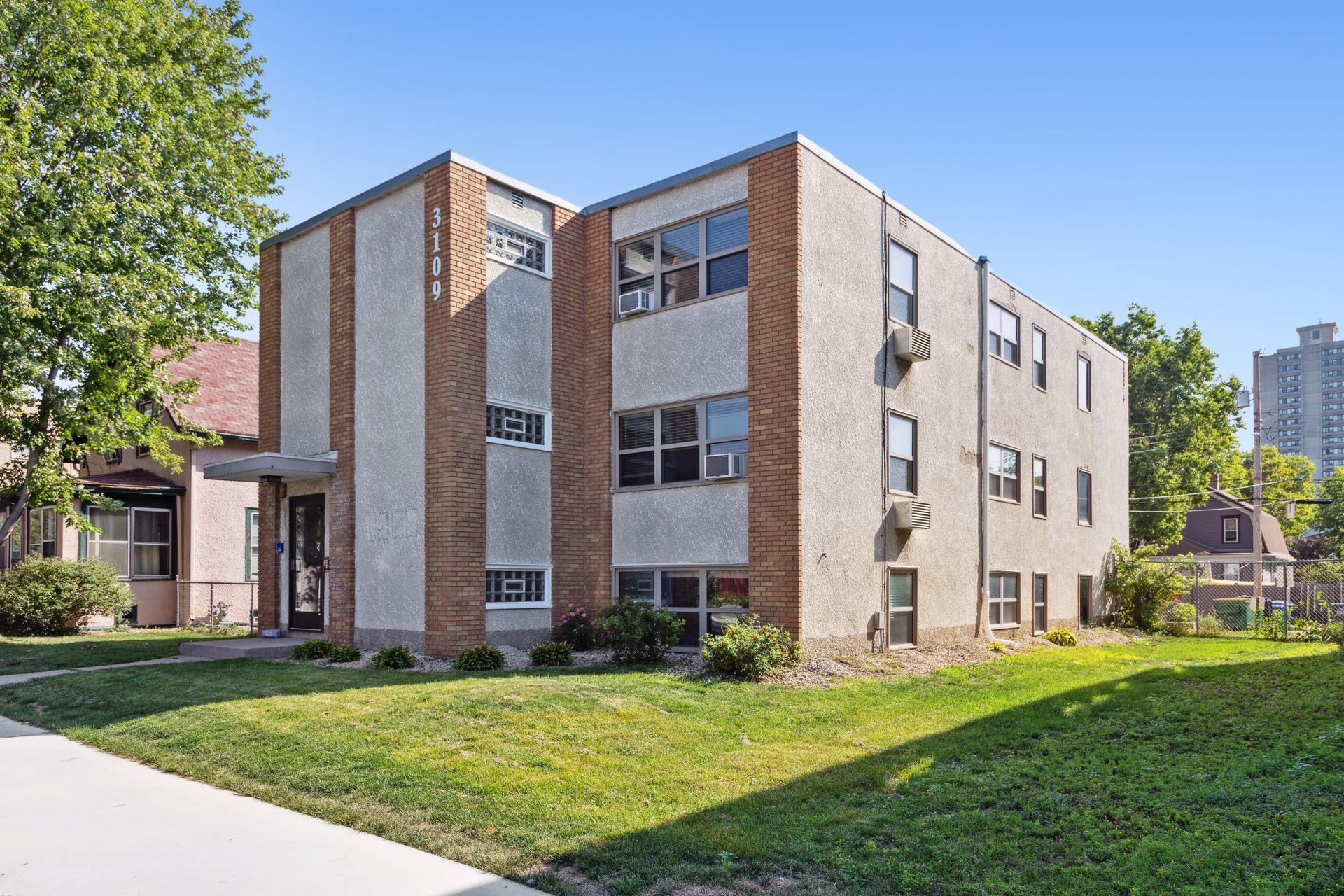 3109 Grand Ave South Minneapolis Mn. 6-unit stucco apartment building with just over 5,000 finished sqft in the heart of uptown blocks from the Minneapolis chain of Lakes.