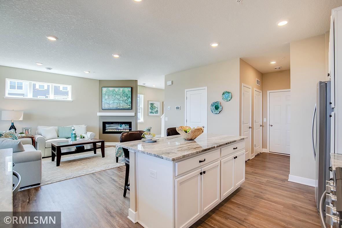 Thoughtfully-designed, modern and fresh describes this kitchen. Equipped with stainless steel appliances, granite counter tops and a large island, this kitchen adds distinction and character to the home.