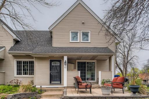 Front entry with pavers patio, walk up porch and a private porch with sliding door to kitchen area