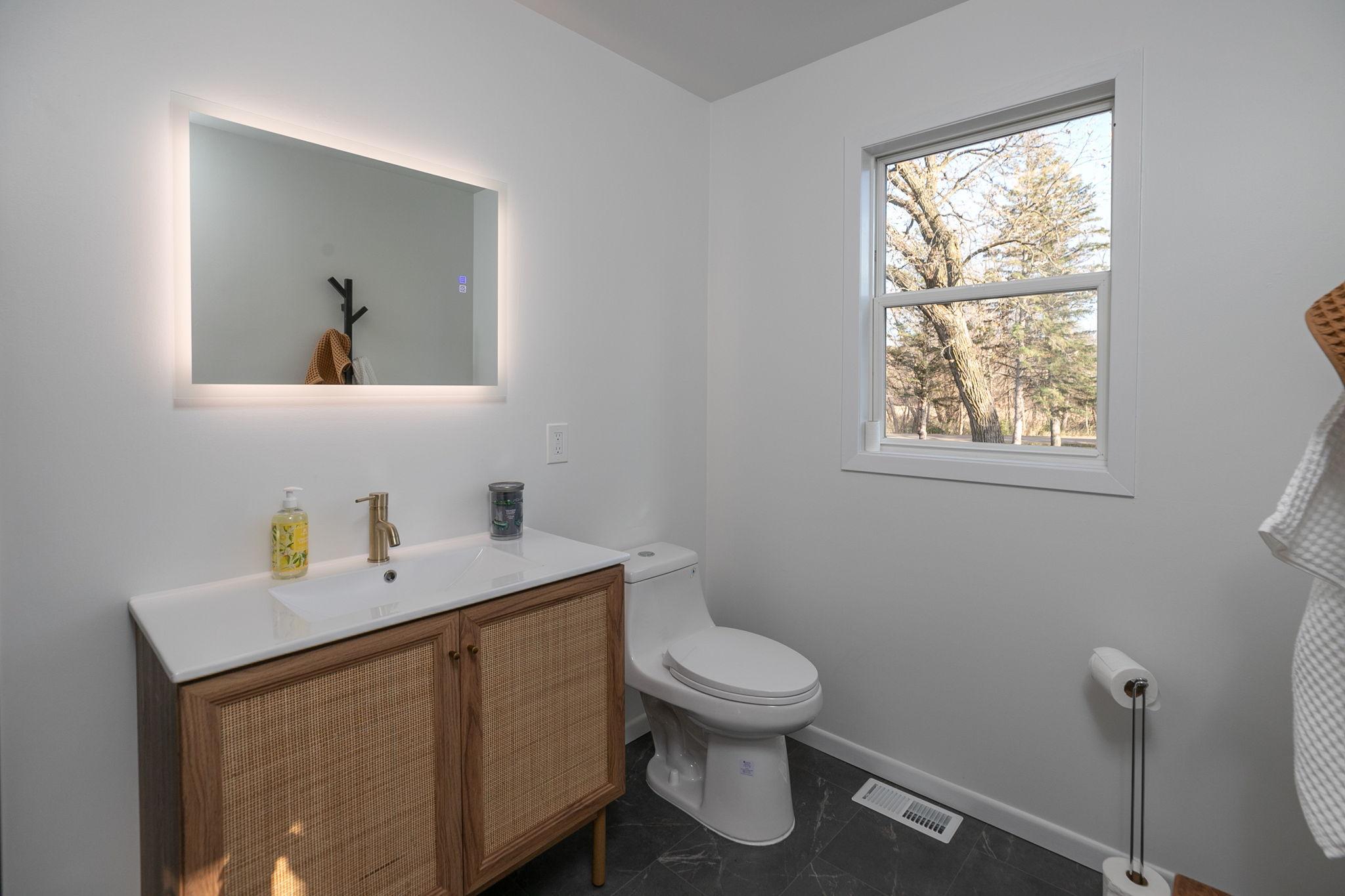 Photo for 2501 4th Avenue NW, Austin, MN 55912 - Listing #6454377 Private Bathroom, Energy efficient toilet, Fog free lit mirror, Color changing Bluetooth bath fan