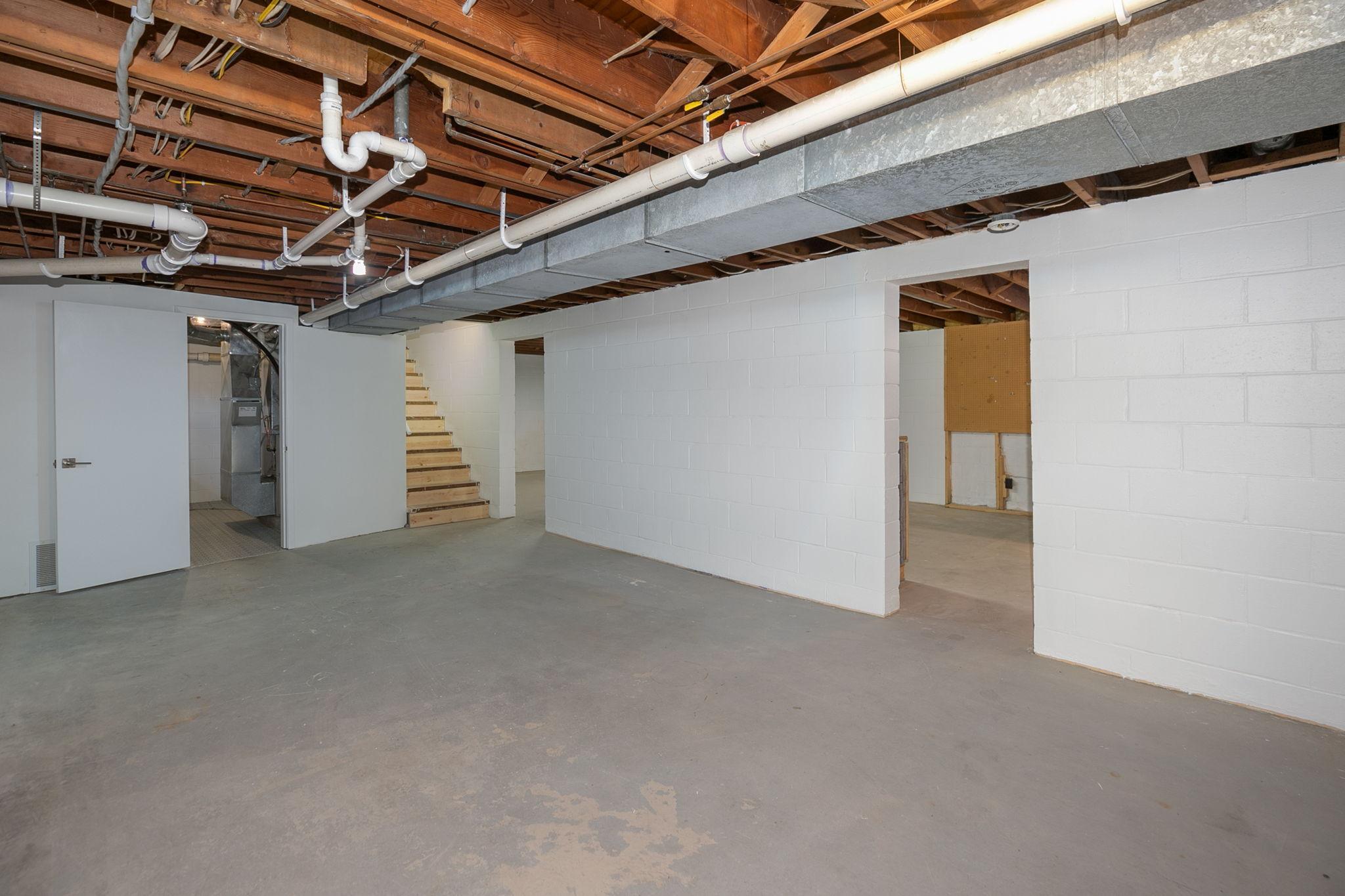Photo for 2501 4th Avenue NW, Austin, MN 55912 - Listing #6454377 Lower Level. At the far left you can catch a glimpse of the brand new furnace, Air conditioner, and water heater
