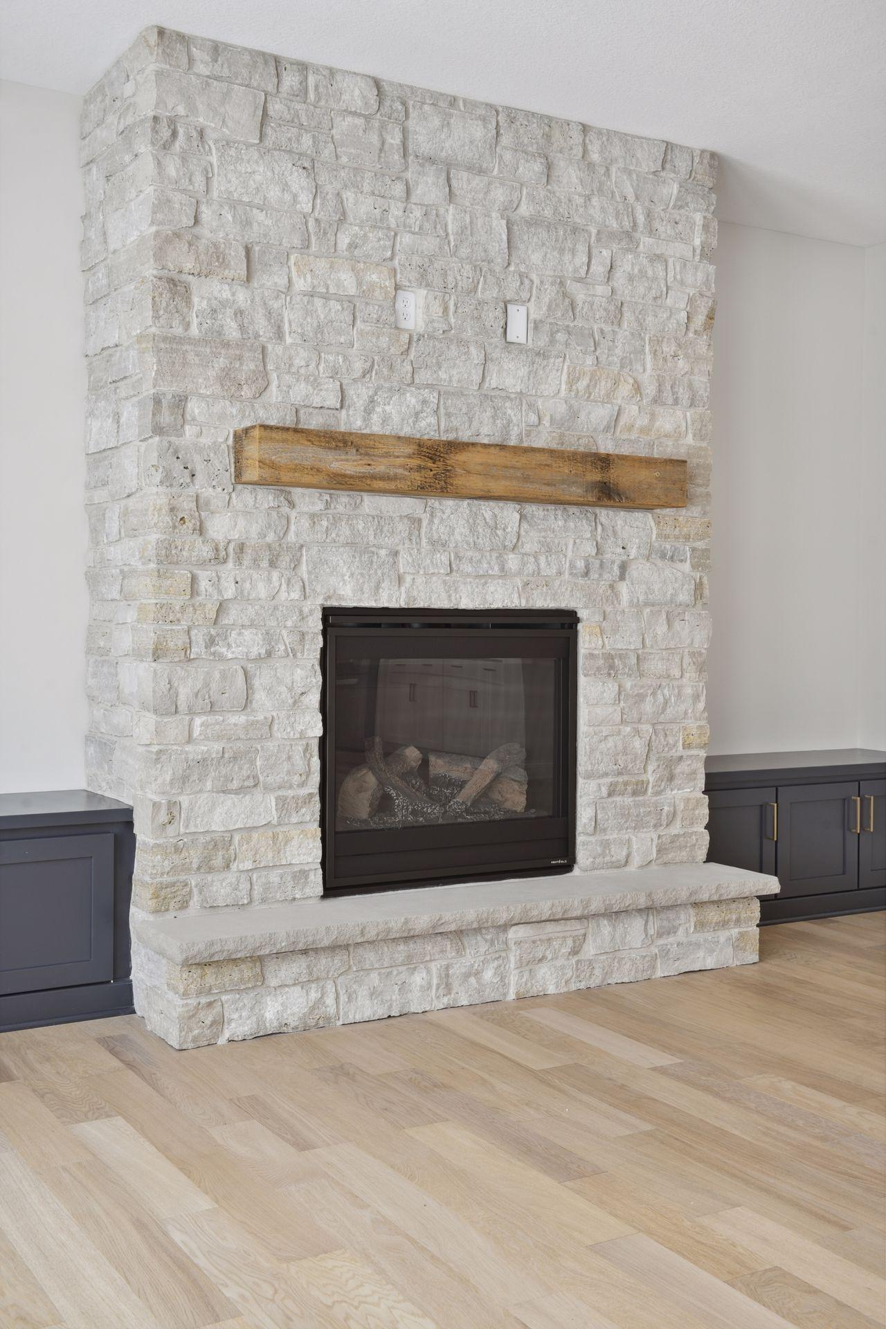 Stone fireplace with hearth and box mantle