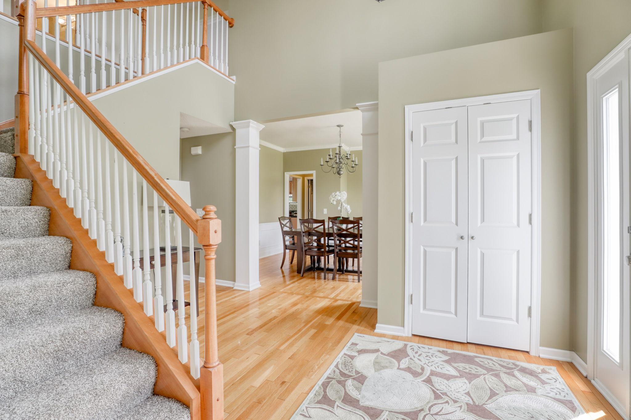 Welcoming 2 story foyer with grand staircase