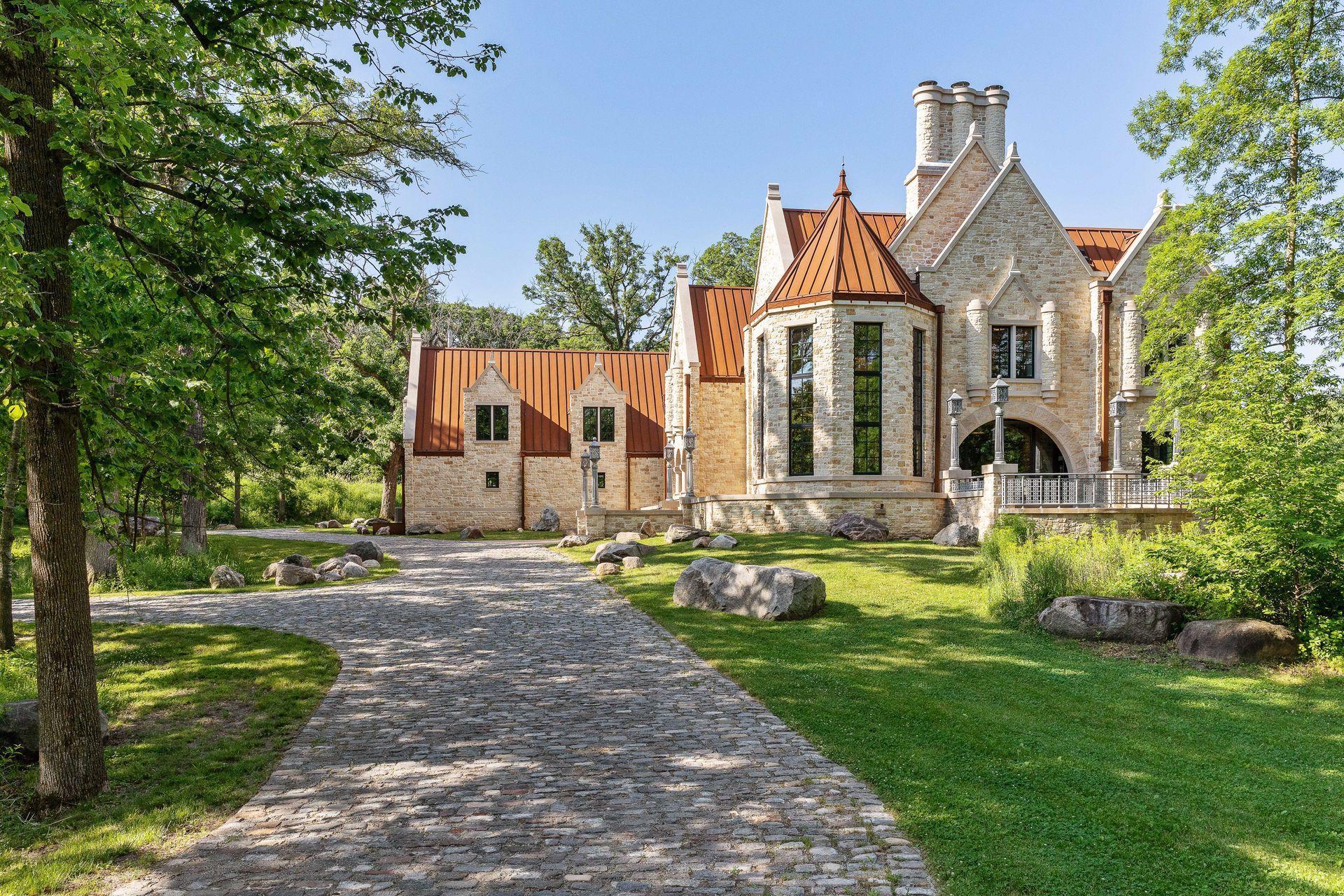 Situated on 3.37 acres in the coveted Orono countryside, Huntington Manor is a prestigious estate proudly designed by architect James McNeal and crafted by masonry artist Luke Busker, Masonry Builders, LLC.