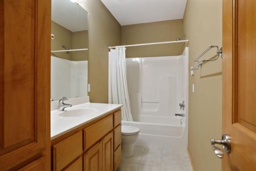 A full bathroom in the lower level is complete with a built -in linen cabinet.