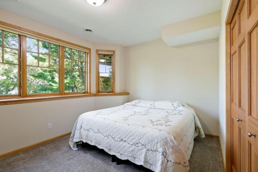 Two of the bedrooms feature bay windows that look towards the lake.