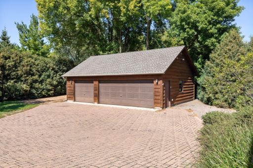 Hard-to-find, there is a second 3 car garage that is plumbed with heat and is a great workshop or man cave!