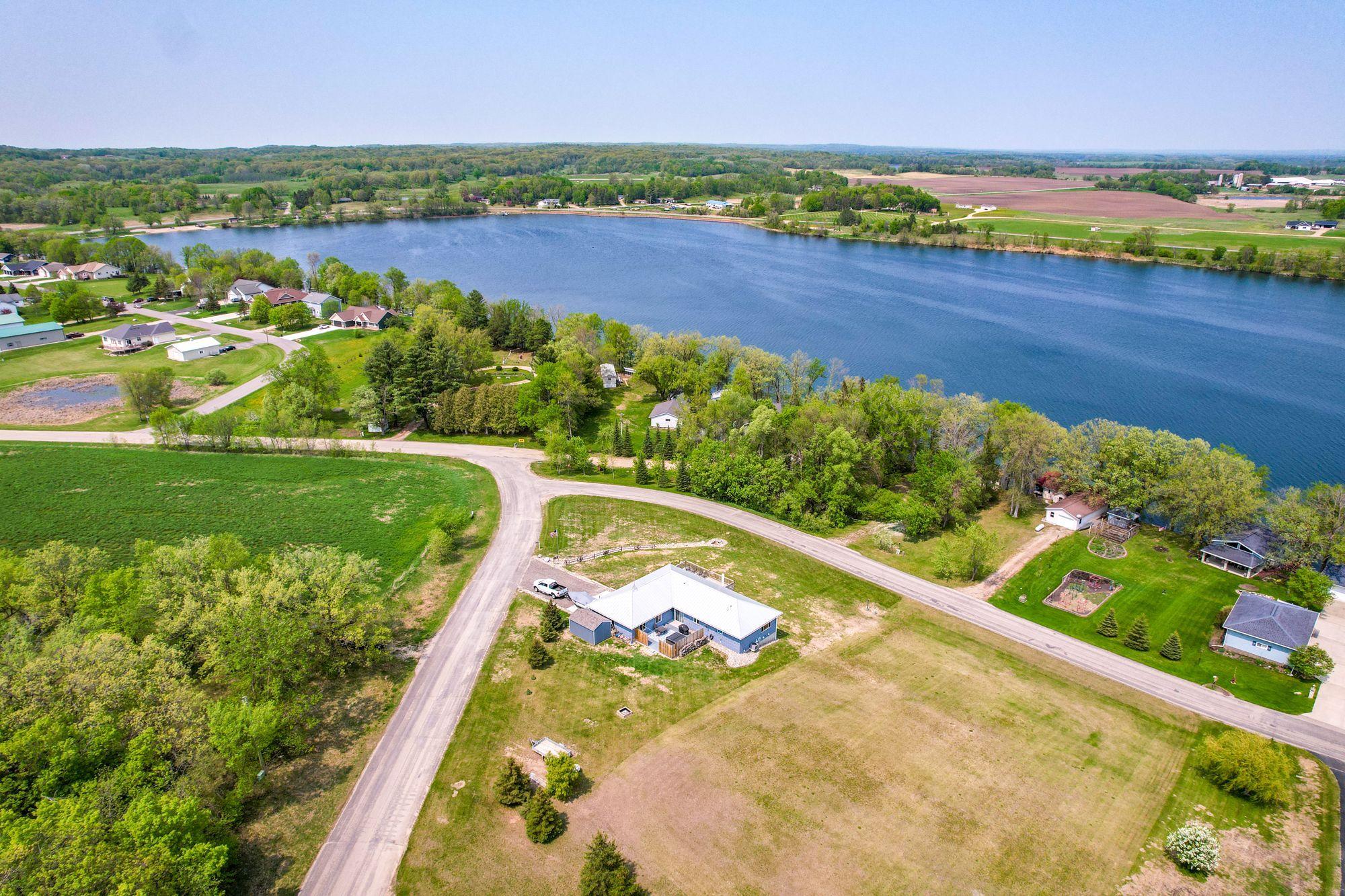 Welcome Home to 100 S Town Line Rd!! Lake living without the maintenance!! Long Lake Public Access directly across from lake. Corner lot on just over a half acre.