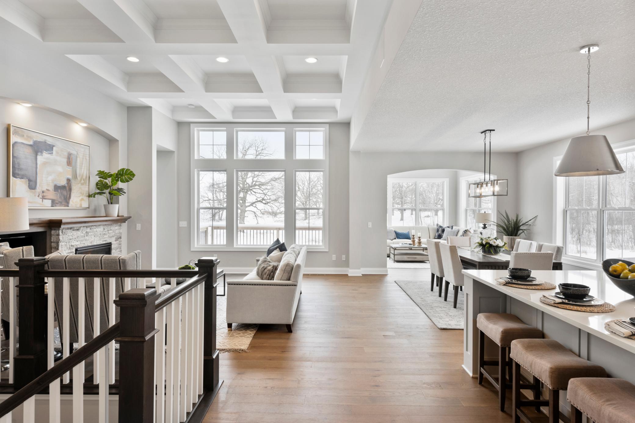 Single Level Living at its best! Association-maintained single family homes currently under construction at Harvest West in Chaska! Dramatic 12' high coffered ceilings in gathering room.