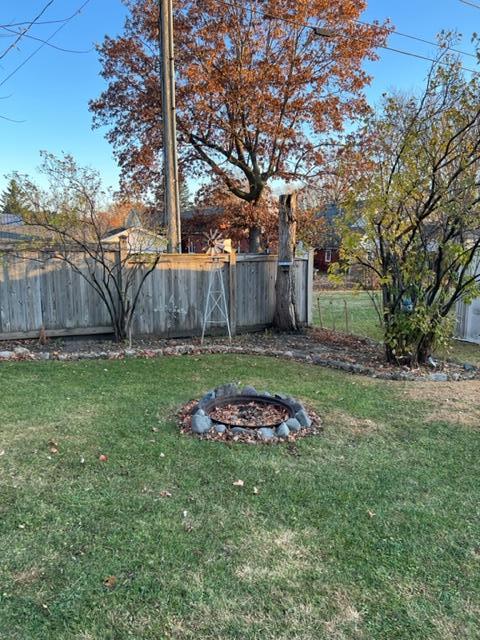 back yard, frence and fire ring.jpg