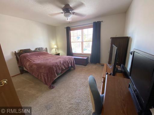 LARGE SECONDARY BEDROOM WITH CEILING FAN AND LIGHT