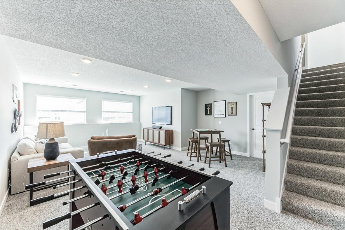 This wonderful lookout basement with amazing natural lighting features a finished rec room area.
