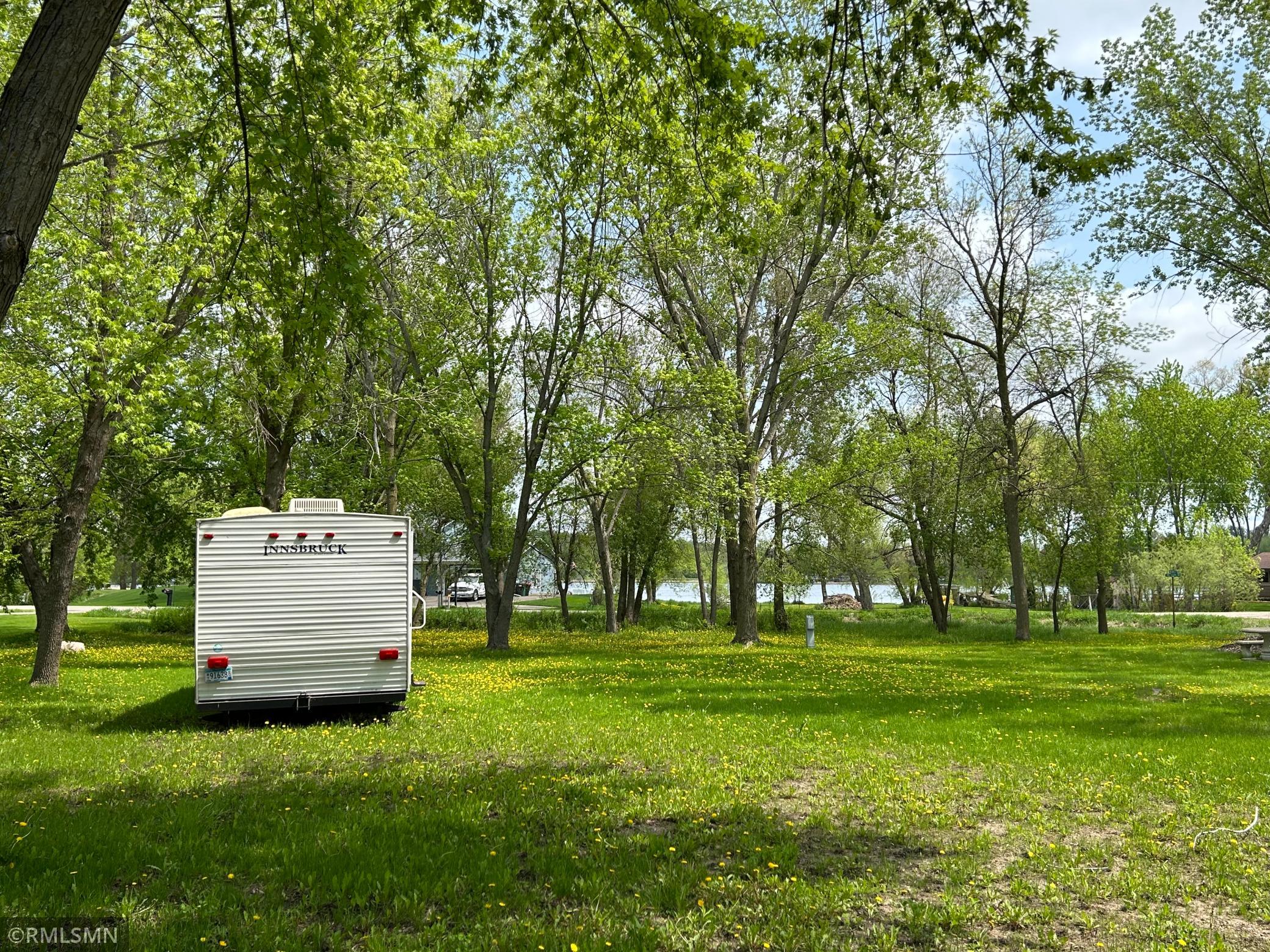 Almost an acre of space to enjoy. Either build your dream home or use for camping. Walk across the street and have fun in the lake. Camper not included.