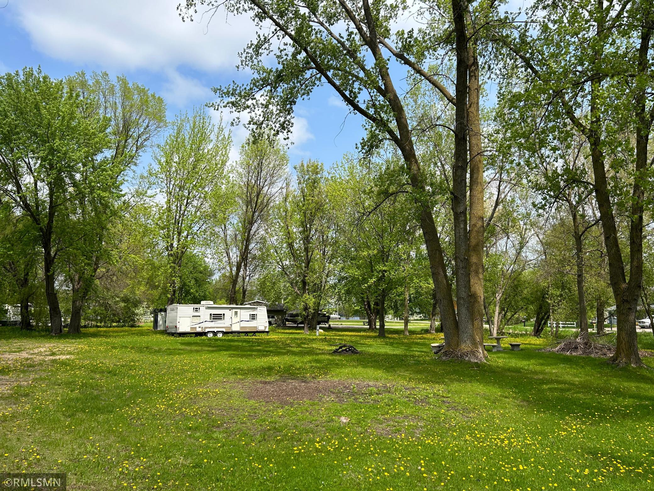 Buildable lot with shared lake access to Two Rivers Lake across the street. Bring your plans for your dream home. Camper not included.