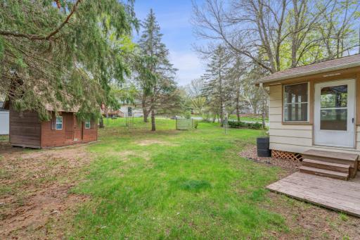 Spacious backyard with large shed/play house.