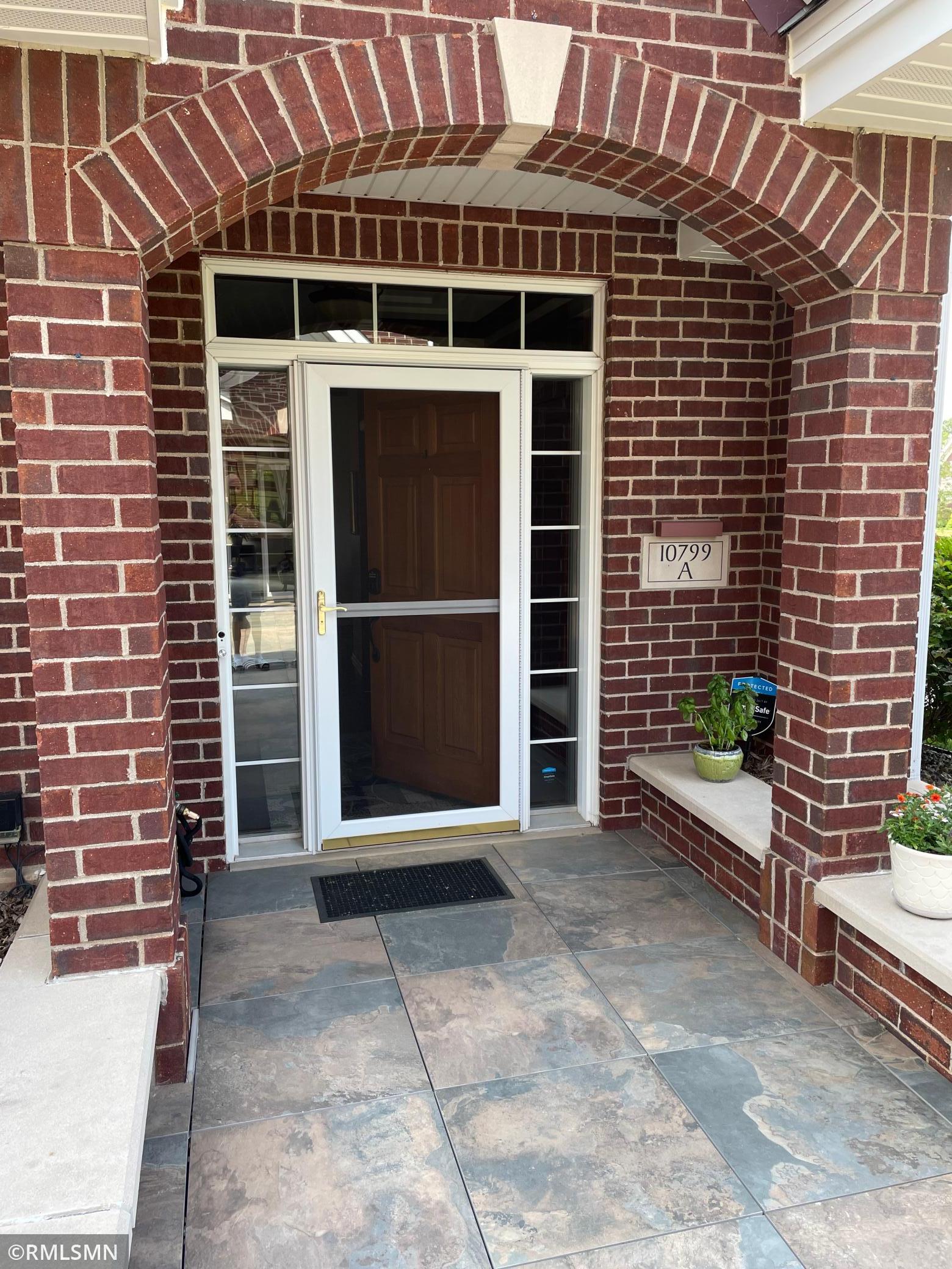 Welcome home to 10799 A, beautiful red brick arch welcomes you and your guests to your home.