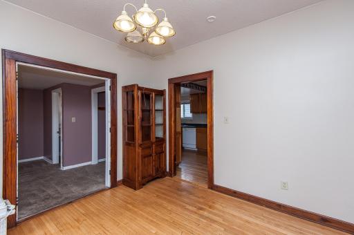 Dining room with wood floors and easy access to the kitchen!
