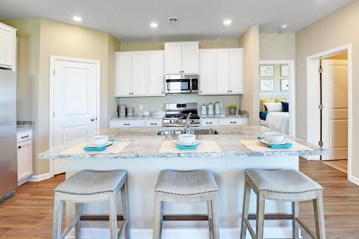 Great open concept kitchen. Model photos. Options and colors will vary.
