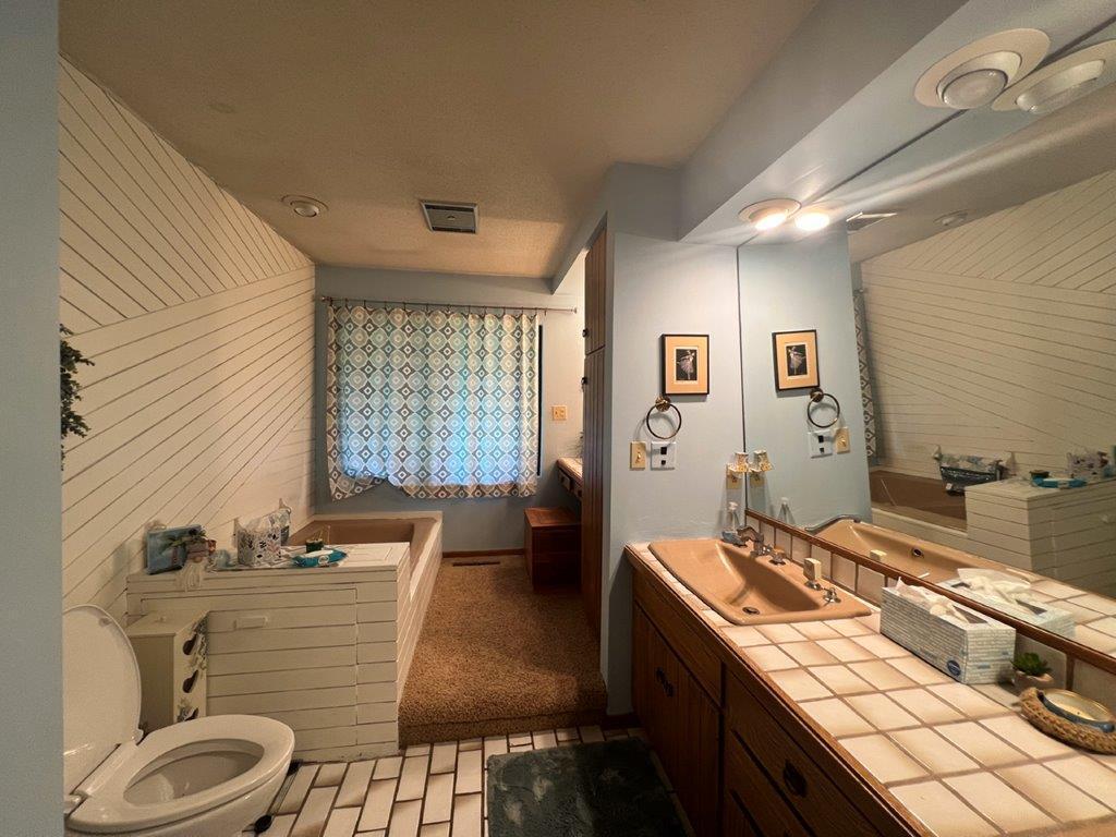 Master Bathroom Main House with Jacuzzi Tub, Stand up Shower, Double Sinks and Vanity